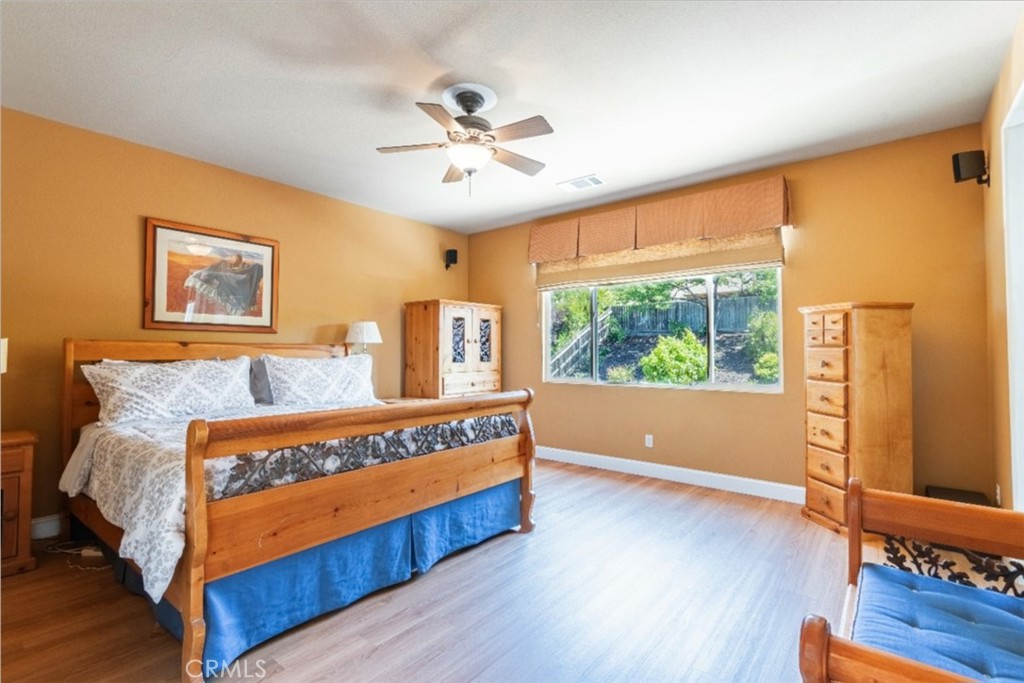 781 Angus Street Paso Robles, CA 93446 - Photo 18 of 34 Large upstairs primary bedroom looks out to the beautiful, landscaped rear yard.