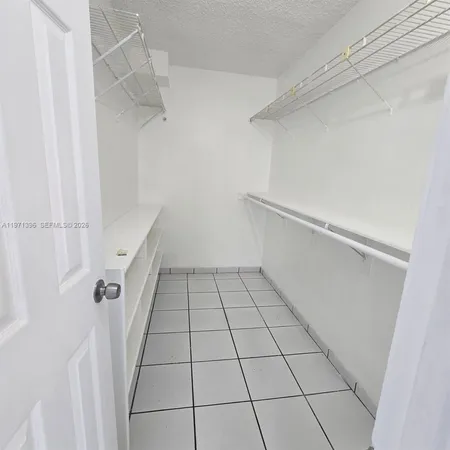 a view of an empty walk in closet