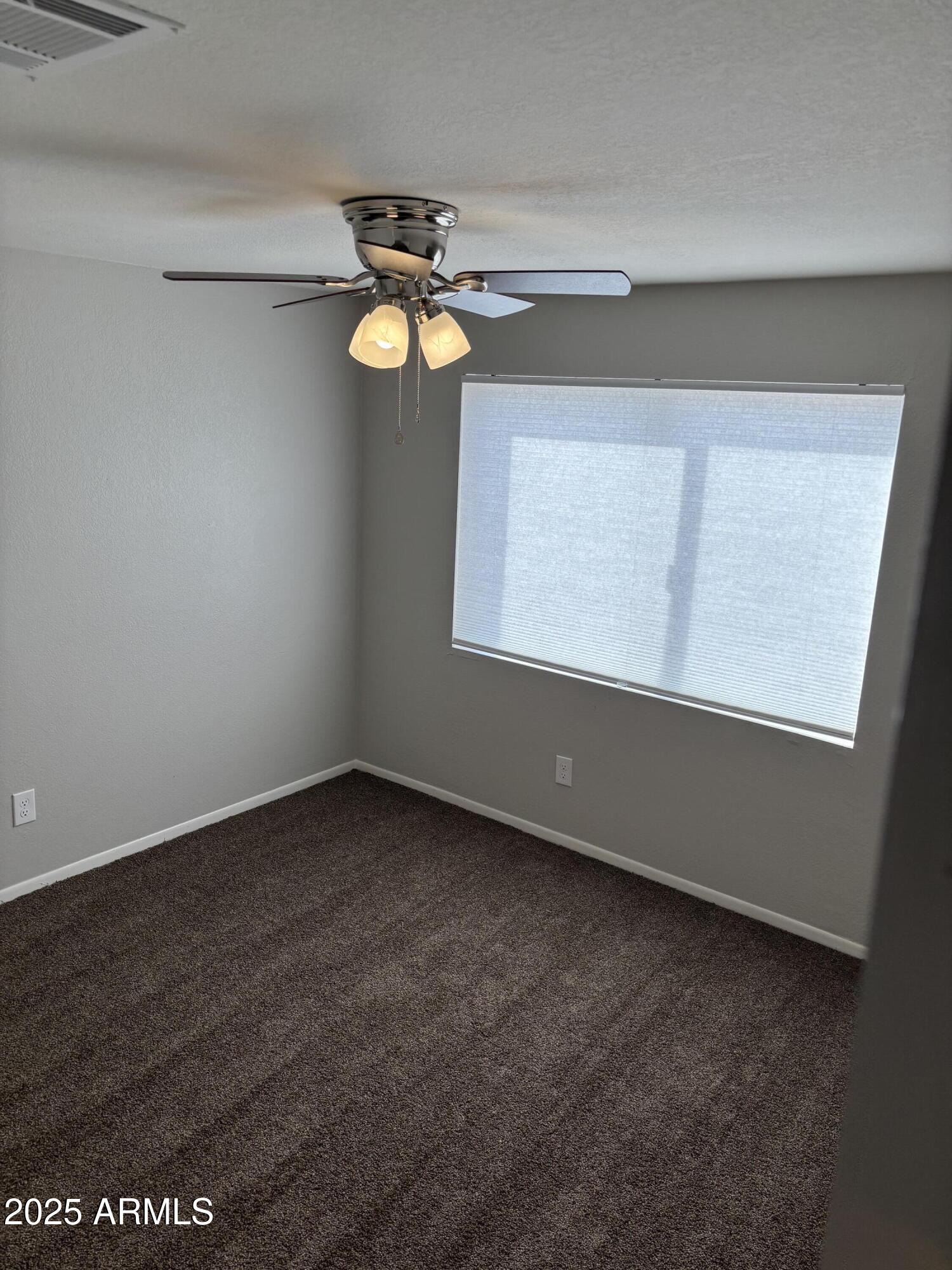 148 South 54th Street, Unit A Mesa, AZ 85206 - Photo 6 of 11 an empty room with a window