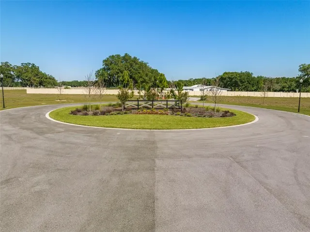 a view of a swimming pool with a yard