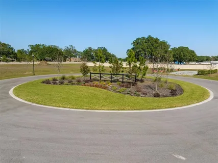 a view of a swimming pool with a yard