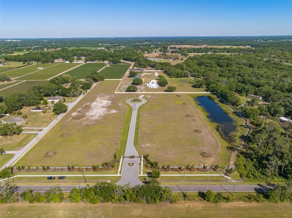 14282 Pine Straw Court Dover, FL 33527 - Photo 5 of 15 a view of a swimming pool with an outdoor space and seating area
