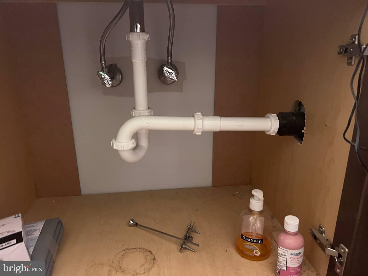 9613 Kendrick Road North Chesterfield, VA 23236 - Photo 62 of 66 Under-sink plumbing details revealed.