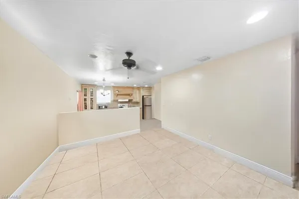 a view of a hallway with a kitchen