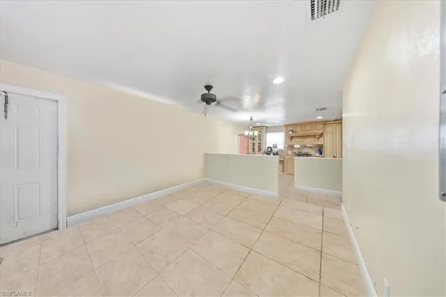 a view of storage and utility room with a window