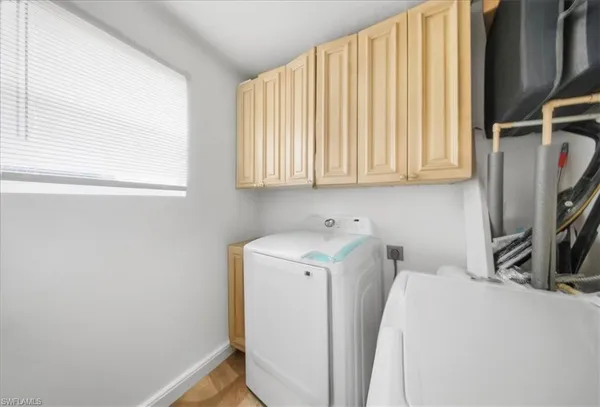a kitchen with stainless steel appliances granite countertop a sink and a stove