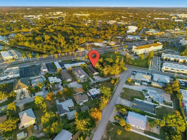 an aerial view of residential houses with outdoor space