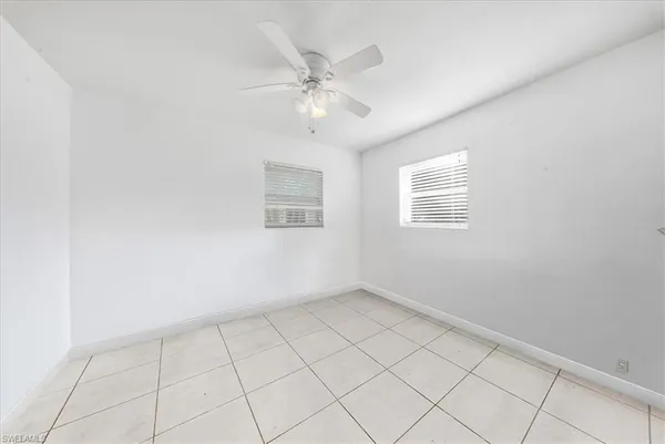 a kitchen with a stove a refrigerator and cabinets