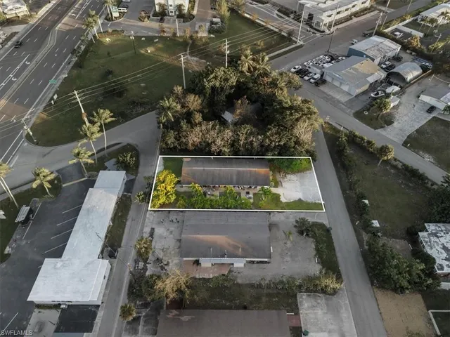an aerial view of a residential houses with outdoor space