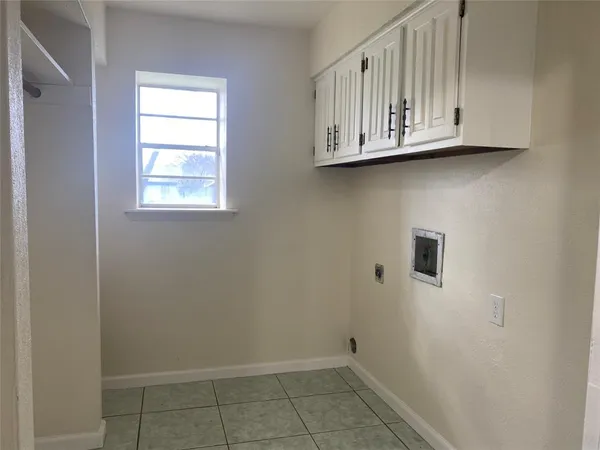 a view of cabinets and window