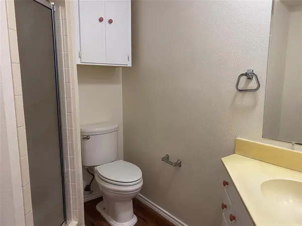 a bathroom with a toilet and a sink