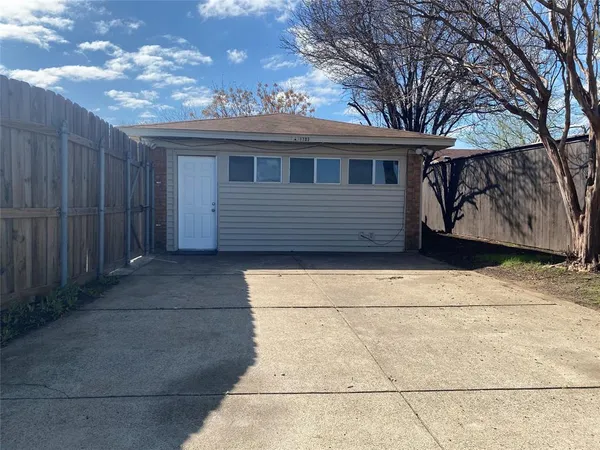a side view of a house with a garage