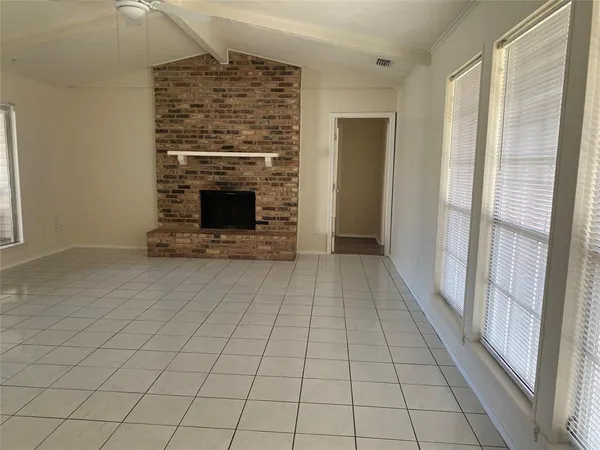 an empty room with fireplace