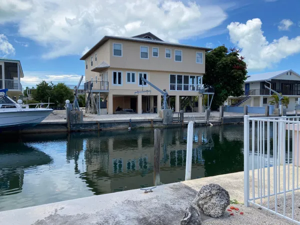 a front view of a house with swimming pool