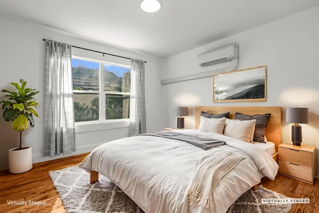 a bedroom with a bed and window