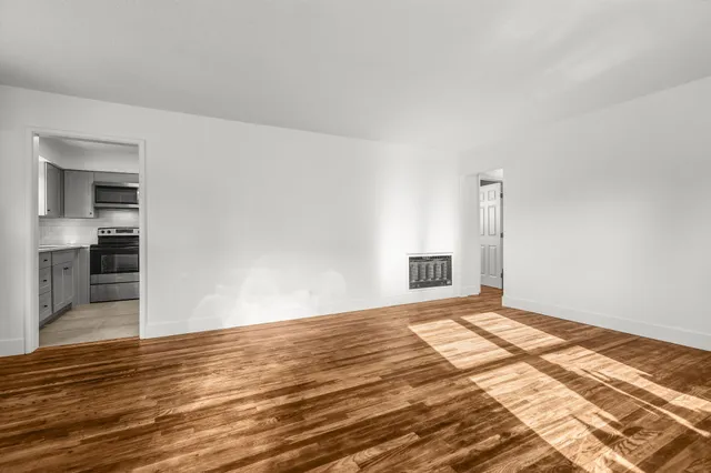 a view of an empty room and window