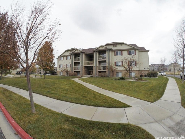 8116 North Ridge Loop West, Unit 8 Eagle Mountain, UT 84005 - Photo 18 of 23 View of front of house featuring a front lawn