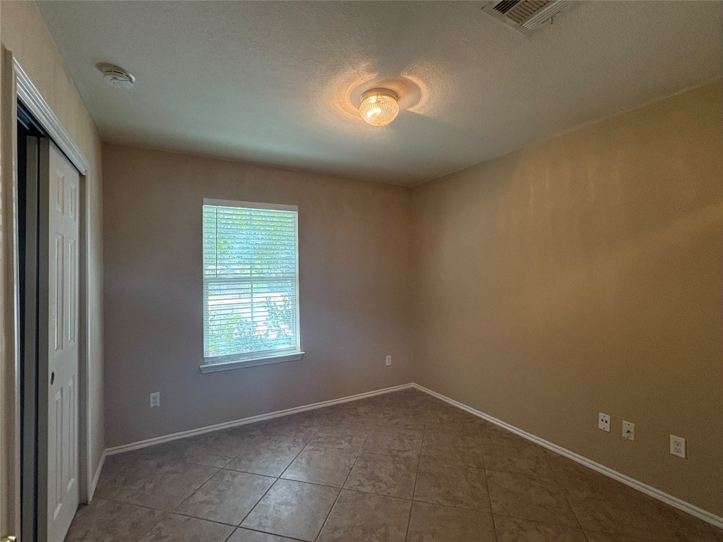 18316 Great Falls Drive Manor, TX 78653 - Photo 20 of 25 an empty room with a window