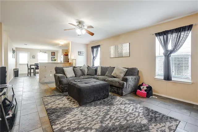 a living room with furniture and a large window