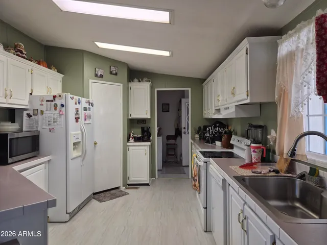 a living room with lots of furniture and a chandelier