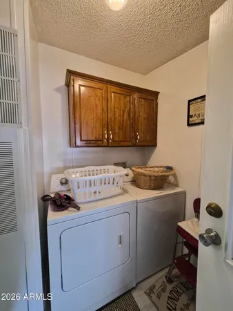 a living room with lots of furniture and a chandelier