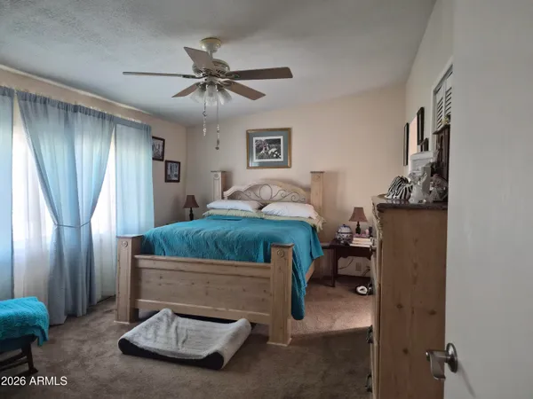 a bedroom with a bed and furniture