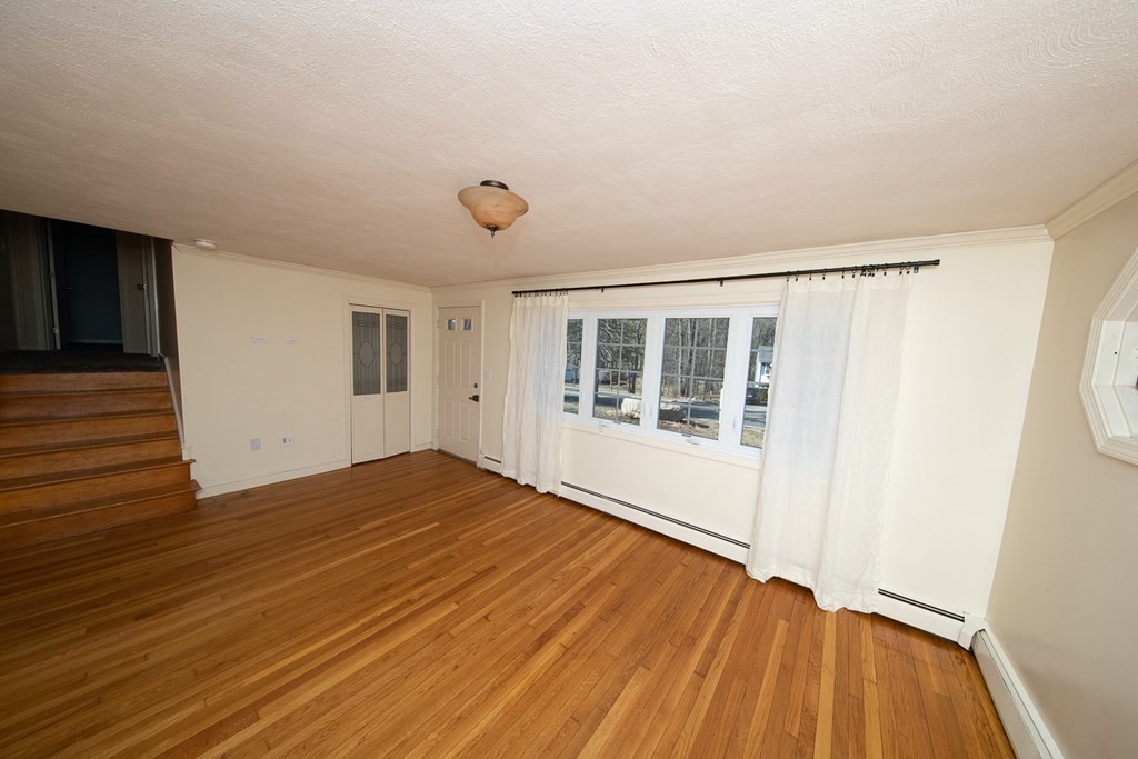 149 Salem Road Billerica, MA 01821 - Photo 11 of 21 a view of empty room with wooden floor and fan