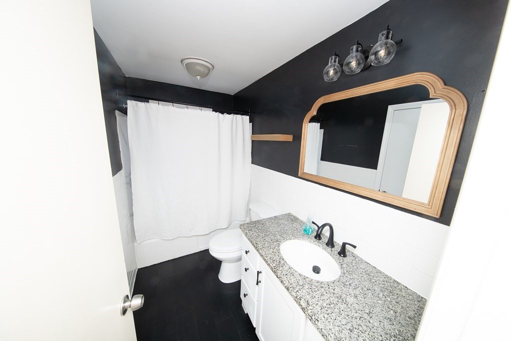 149 Salem Road Billerica, MA 01821 - Photo 12 of 21 a bathroom with a sink and a mirror
