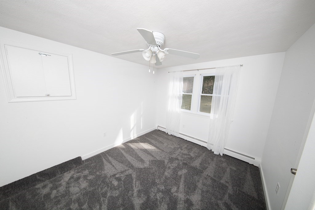 149 Salem Road Billerica, MA 01821 - Photo 15 of 21 an empty room with windows and fan