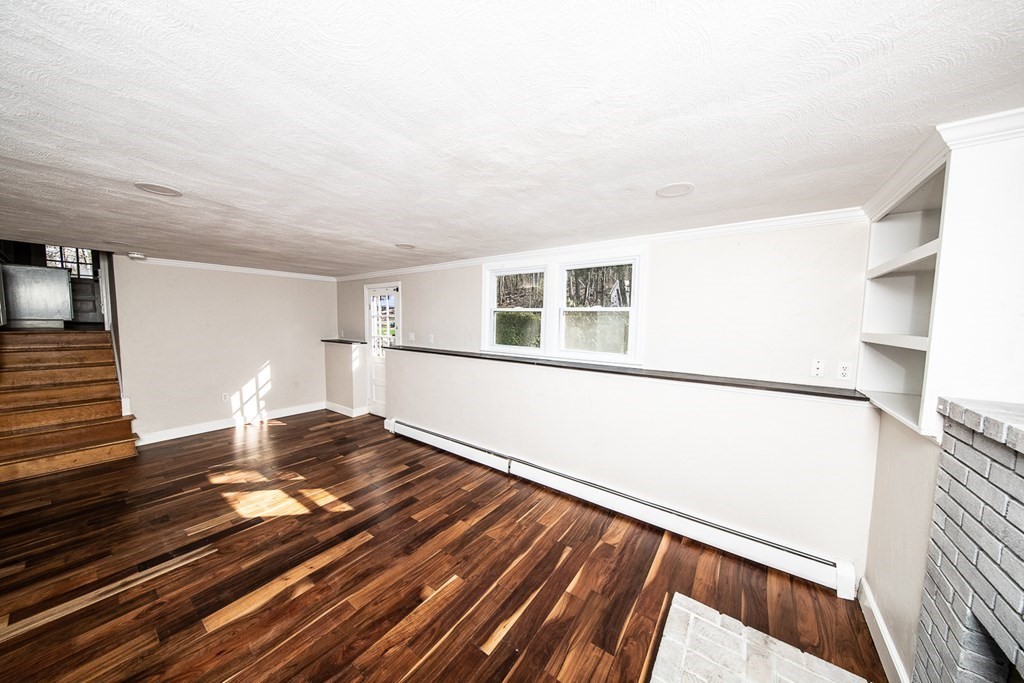 149 Salem Road Billerica, MA 01821 - Photo 18 of 21 a living room with wooden floor