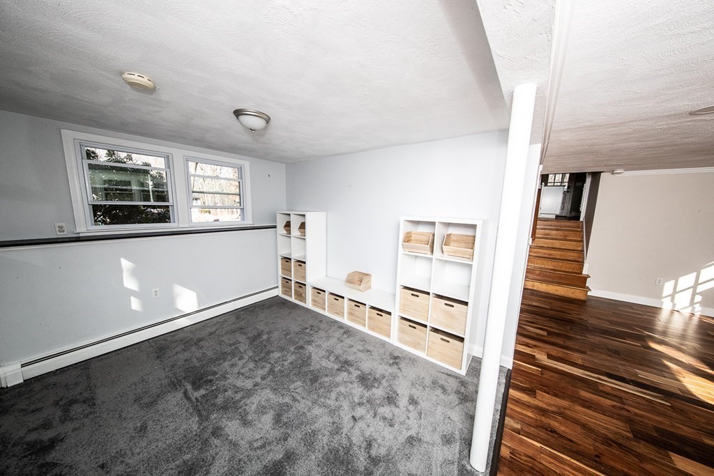 149 Salem Road Billerica, MA 01821 - Photo 19 of 21 wooden floor in an empty room with a window