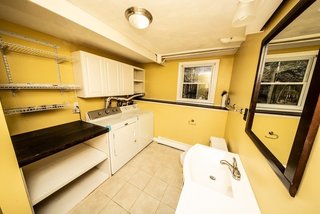 149 Salem Road Billerica, MA 01821 - Photo 21 of 21 a view of a kitchen with a sink and a window