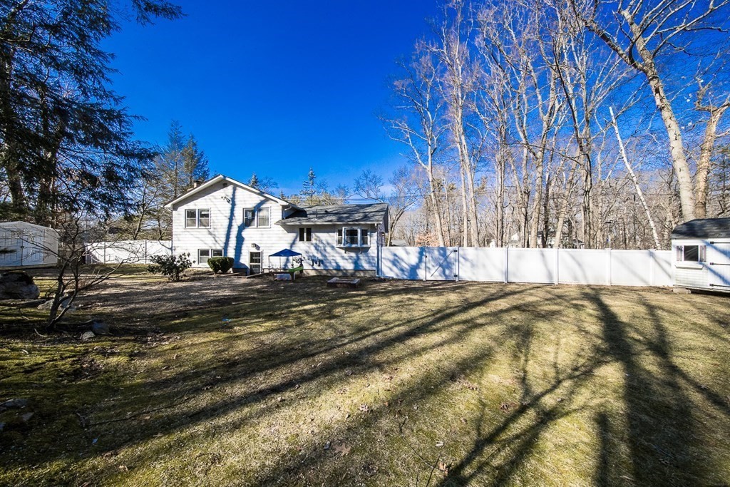 149 Salem Road Billerica, MA 01821 - Photo 6 of 21 a view of a house with a yard covered with snow