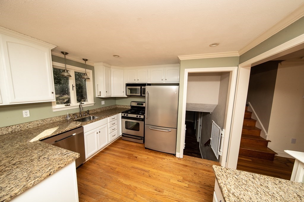 149 Salem Road Billerica, MA 01821 - Photo 9 of 21 a large kitchen with stainless steel appliances granite countertop a refrigerator and a sink