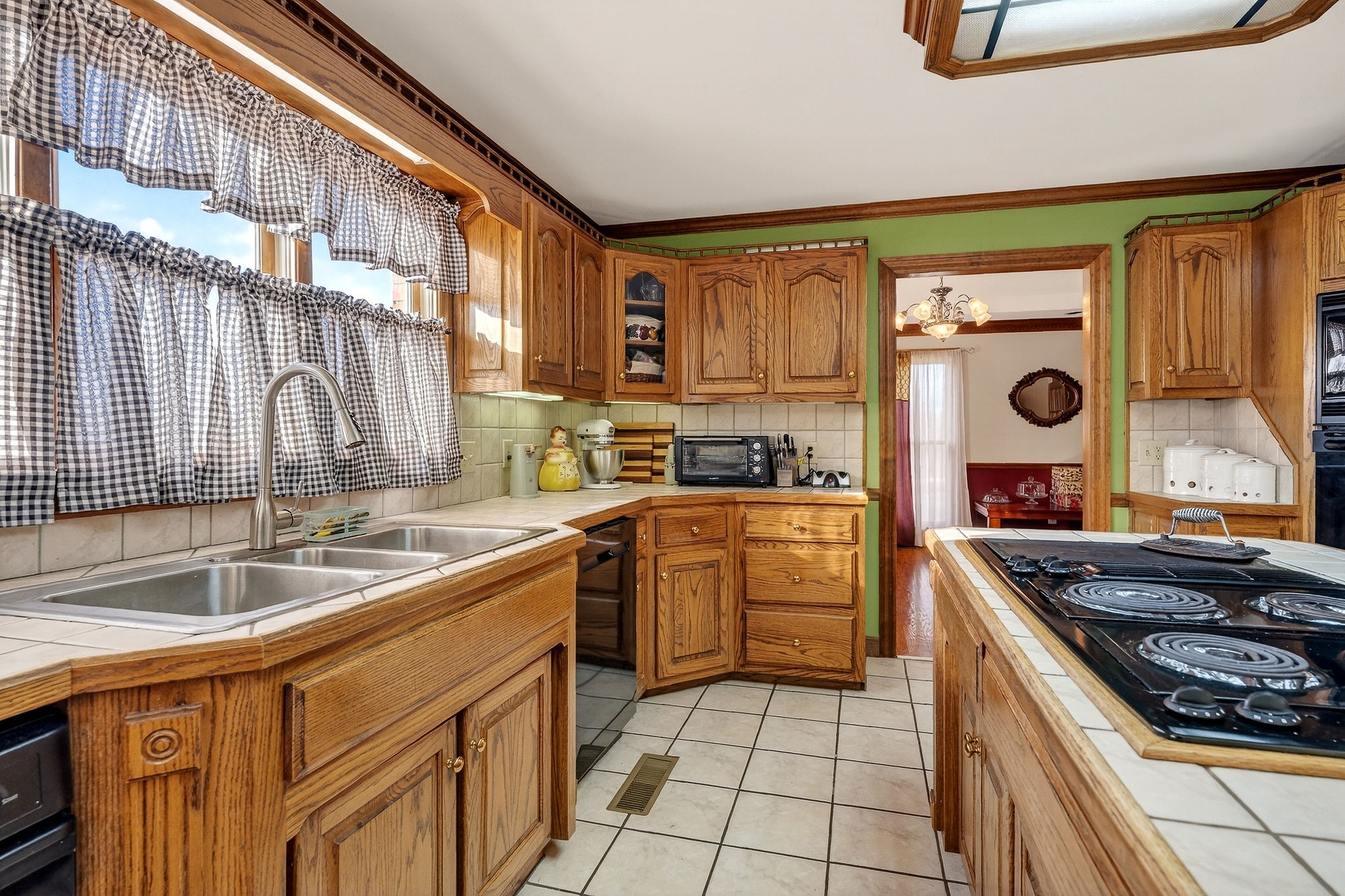 9334 Short Mountain Road Smithville, TN 37166 - Photo 12 of 51 a kitchen with a stove a sink and a refrigerator