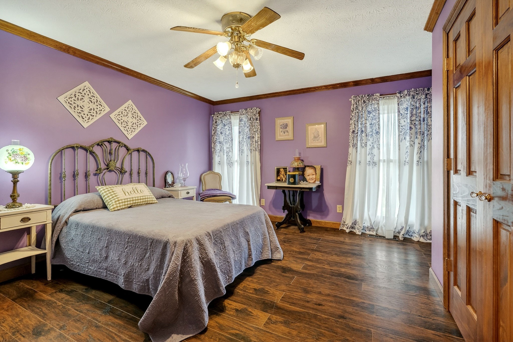 9334 Short Mountain Road Smithville, TN 37166 - Photo 21 of 51 a bedroom with a bed and a chandelier