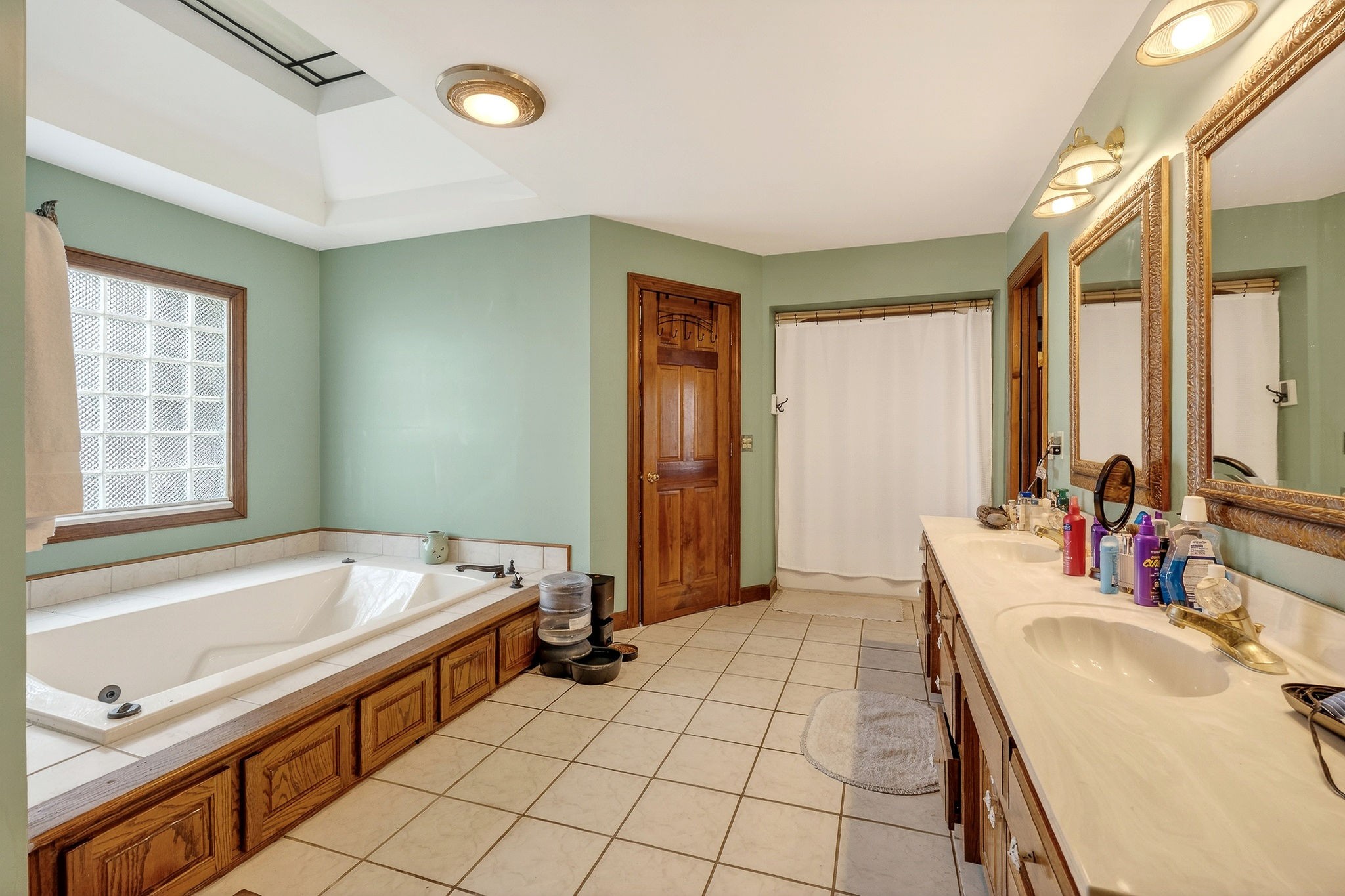 9334 Short Mountain Road Smithville, TN 37166 - Photo 25 of 51 a spacious bathroom with a tub sink and mirror