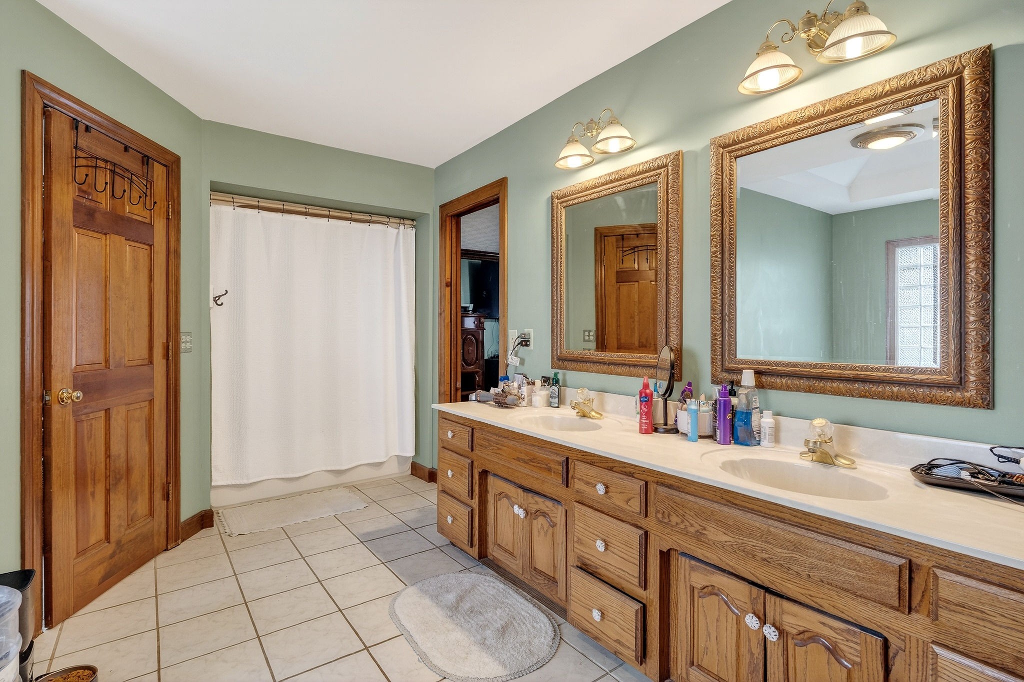 9334 Short Mountain Road Smithville, TN 37166 - Photo 26 of 51 a spacious bathroom with a double vanity sink a mirror and a shower