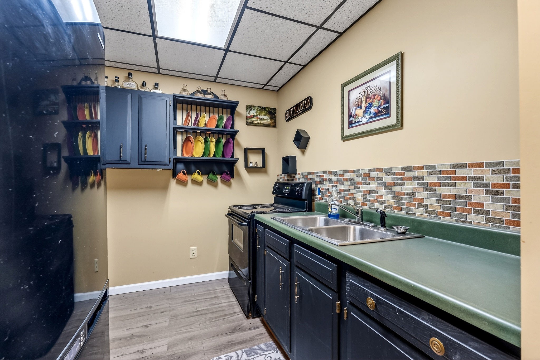 9334 Short Mountain Road Smithville, TN 37166 - Photo 36 of 51 a kitchen with a sink and cabinets