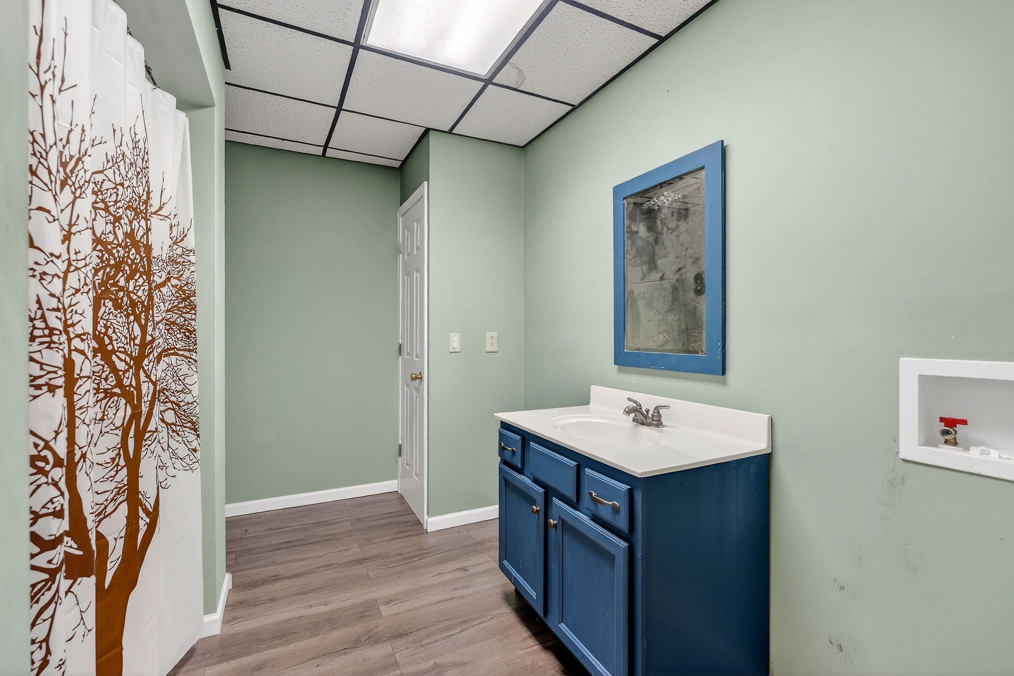 9334 Short Mountain Road Smithville, TN 37166 - Photo 37 of 51 a bathroom with a sink and a mirror