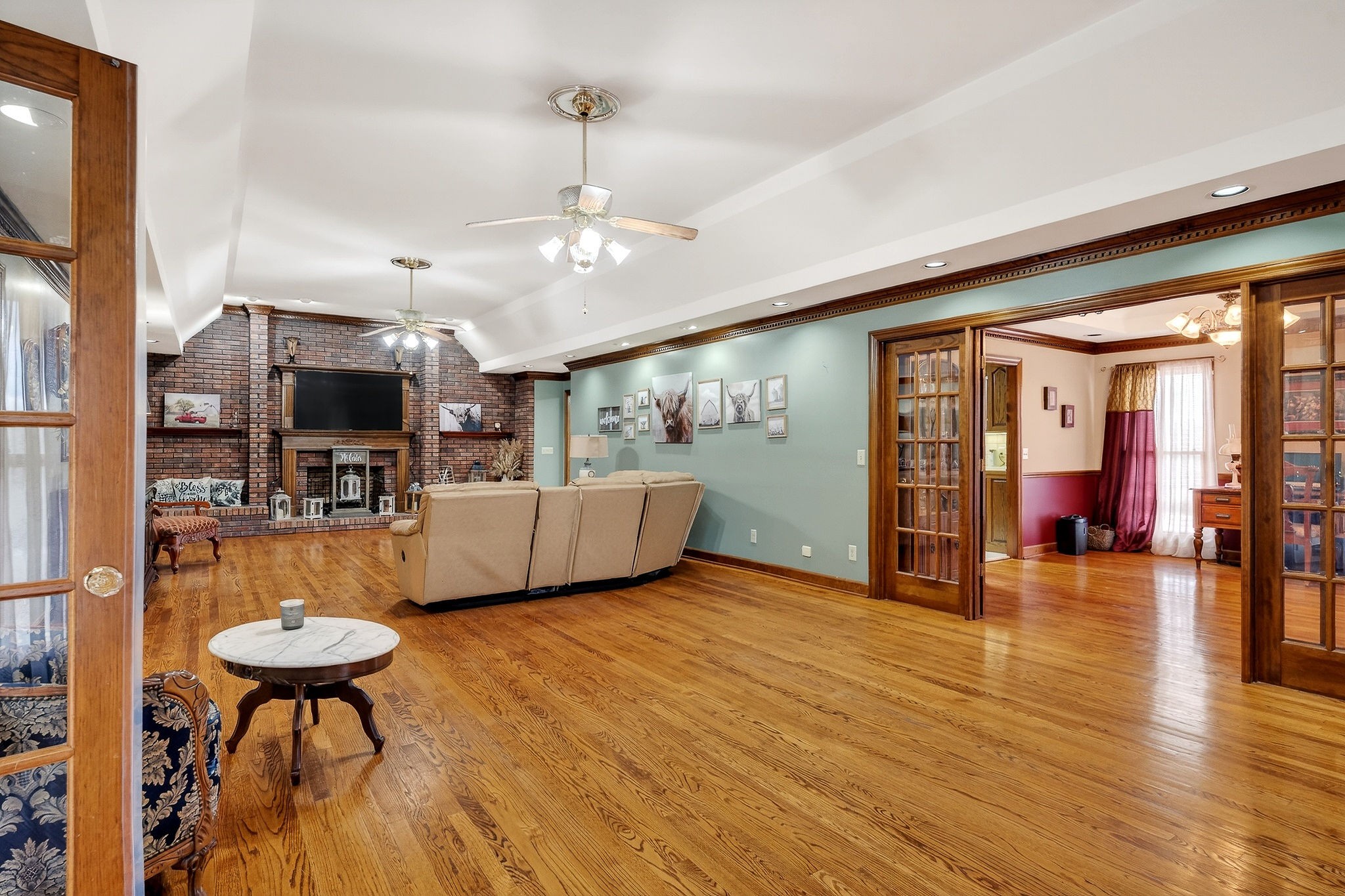 9334 Short Mountain Road Smithville, TN 37166 - Photo 6 of 51 a view of a livingroom with furniture a flat screen tv and front door