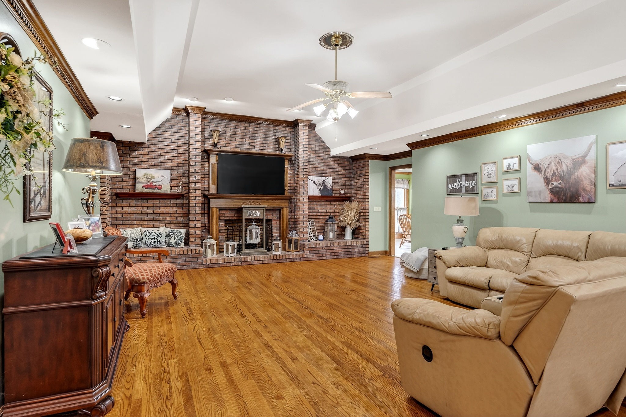 9334 Short Mountain Road Smithville, TN 37166 - Photo 8 of 51 a living room with fireplace furniture and a flat screen tv