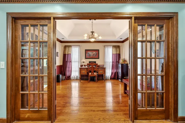 a kitchen with stainless steel appliances granite countertop a stove a refrigerator a sink and dishwasher with a dining table