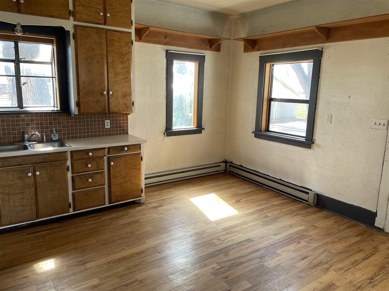 2373 I Road Grand Junction, CO 81505 - Photo 15 of 20 a view of a kitchen with wooden floor and a sink
