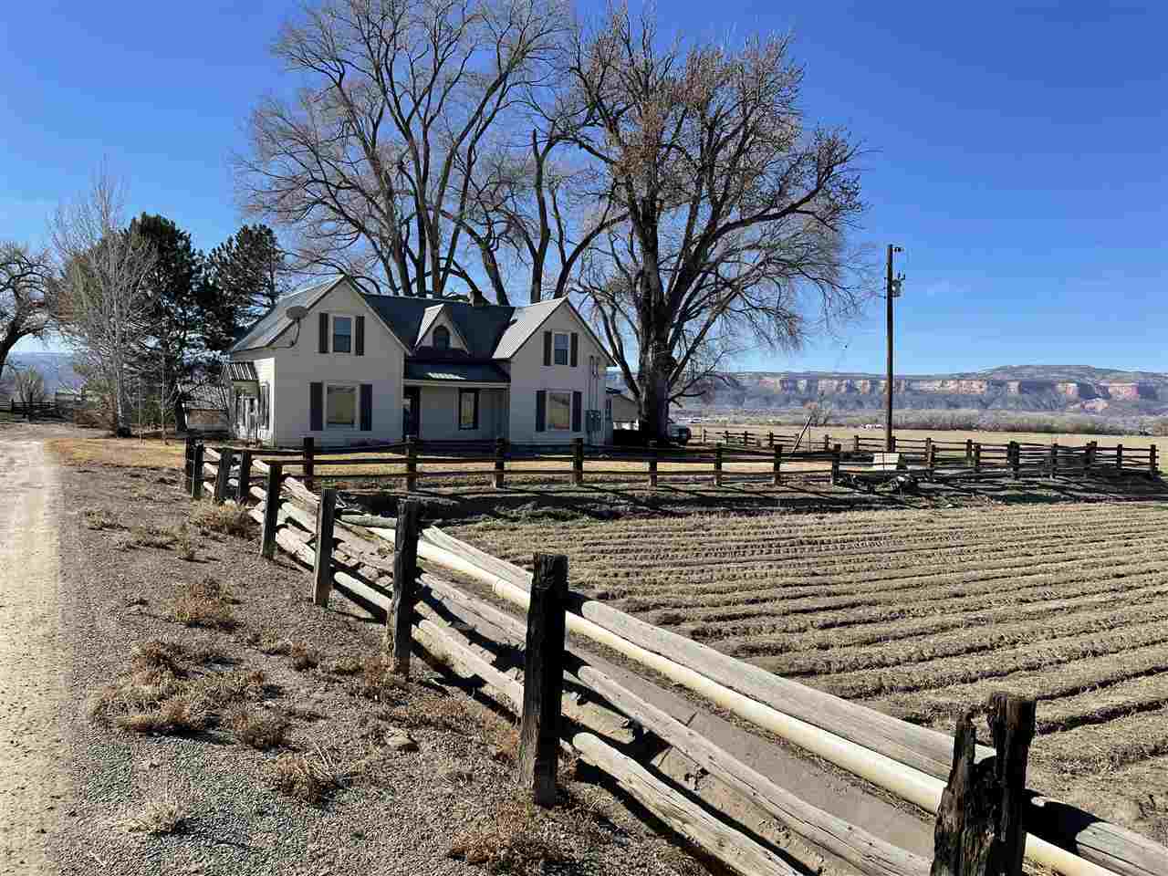 2373 I Road Grand Junction, CO 81505 - Photo 6 of 20 a view of a lake with a bench