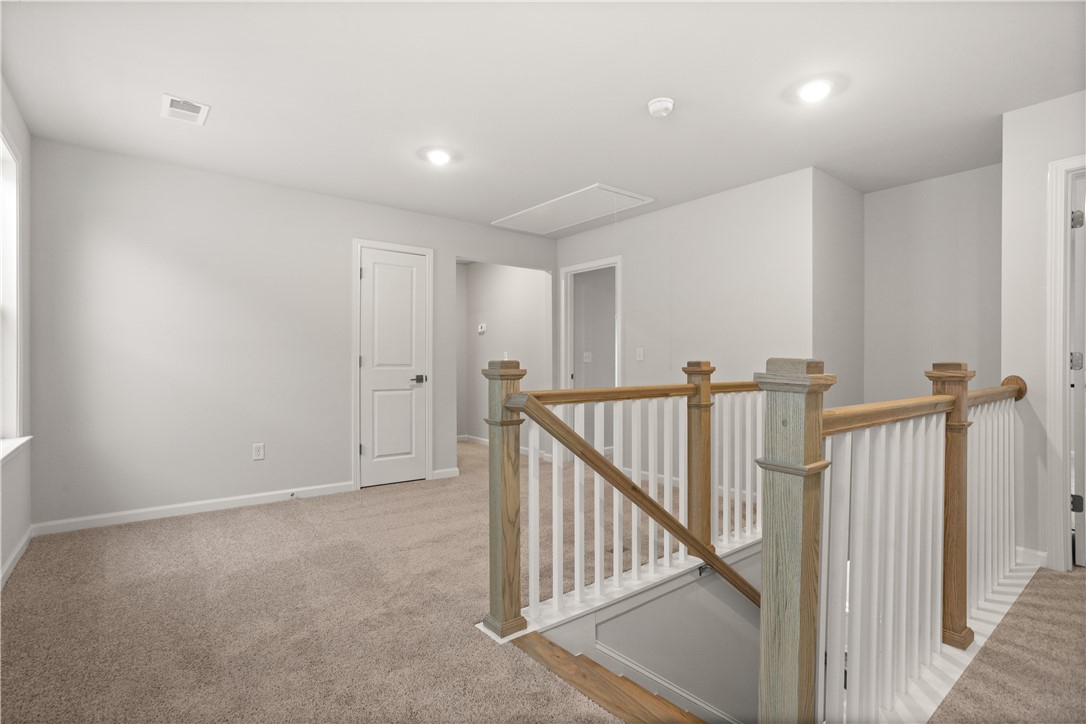631 Sweetspire Trail, Unit 148 Seneca, SC 29678 - Photo 19 of 36 A versatile upper-level flex space offers plush carpeting and bright recessed lighting.