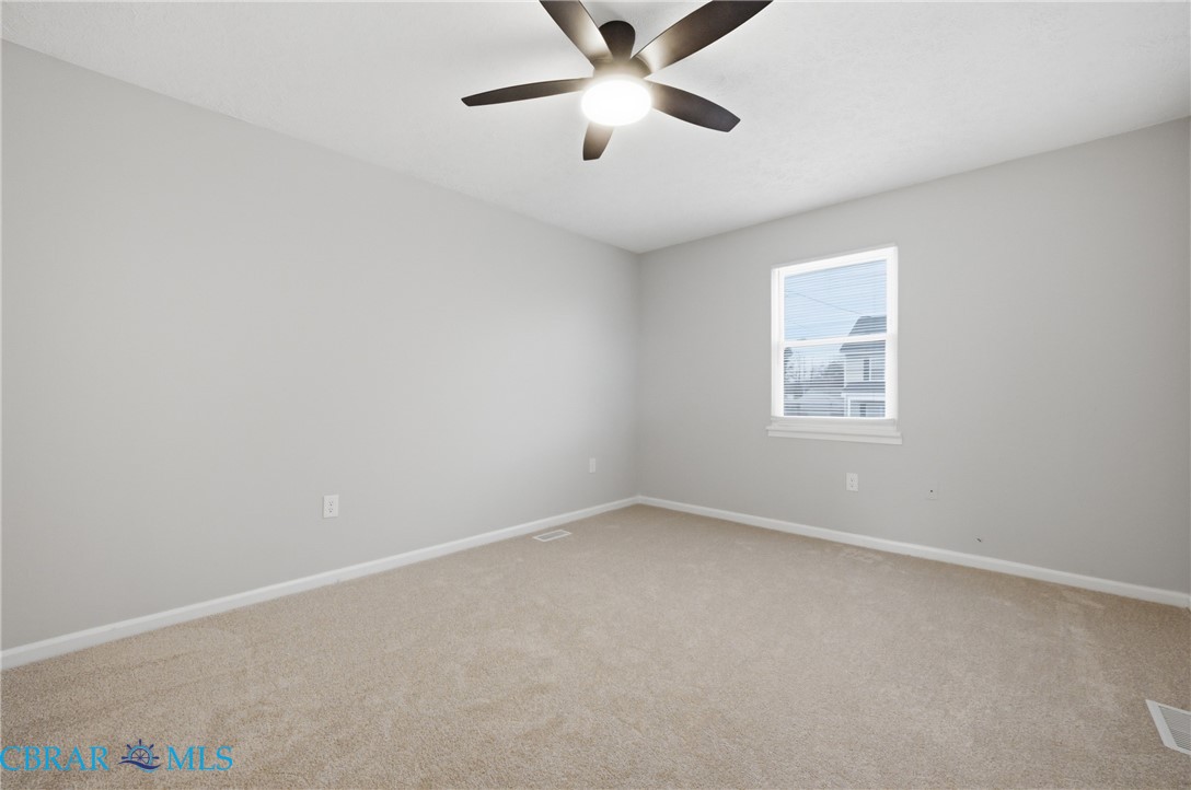 733 Spruce Street Hampton, VA 23661 - Photo 17 of 29 Carpeted spare room featuring baseboards and ceiling fan