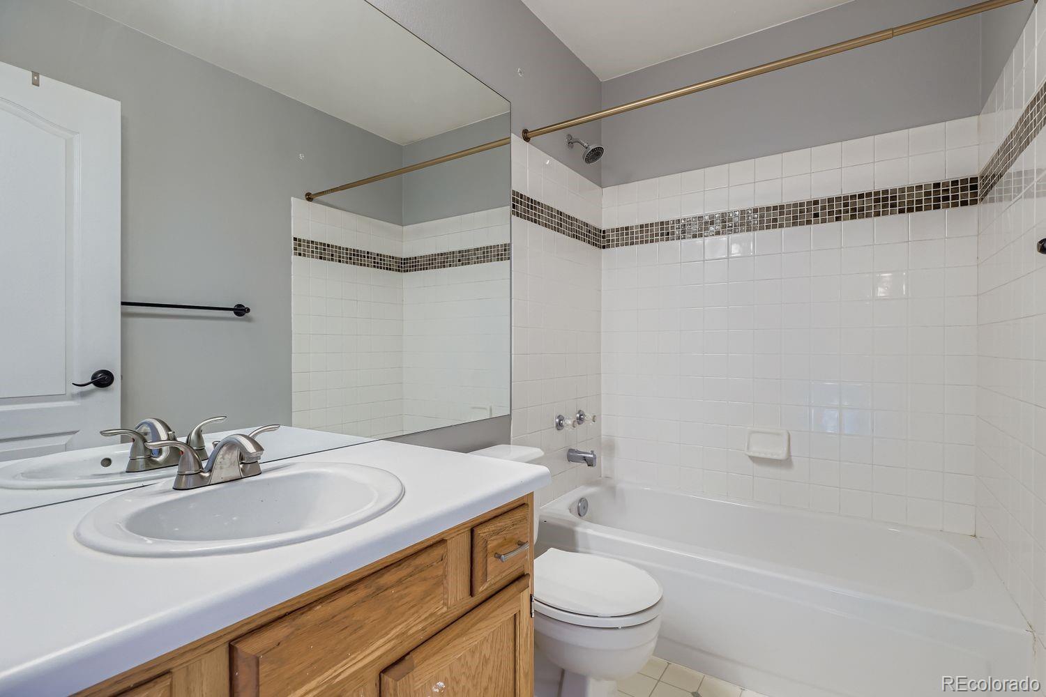 19827 East Prentice Avenue Centennial, CO 80015 - Photo 23 of 31 a bathroom with a sink toilet and shower