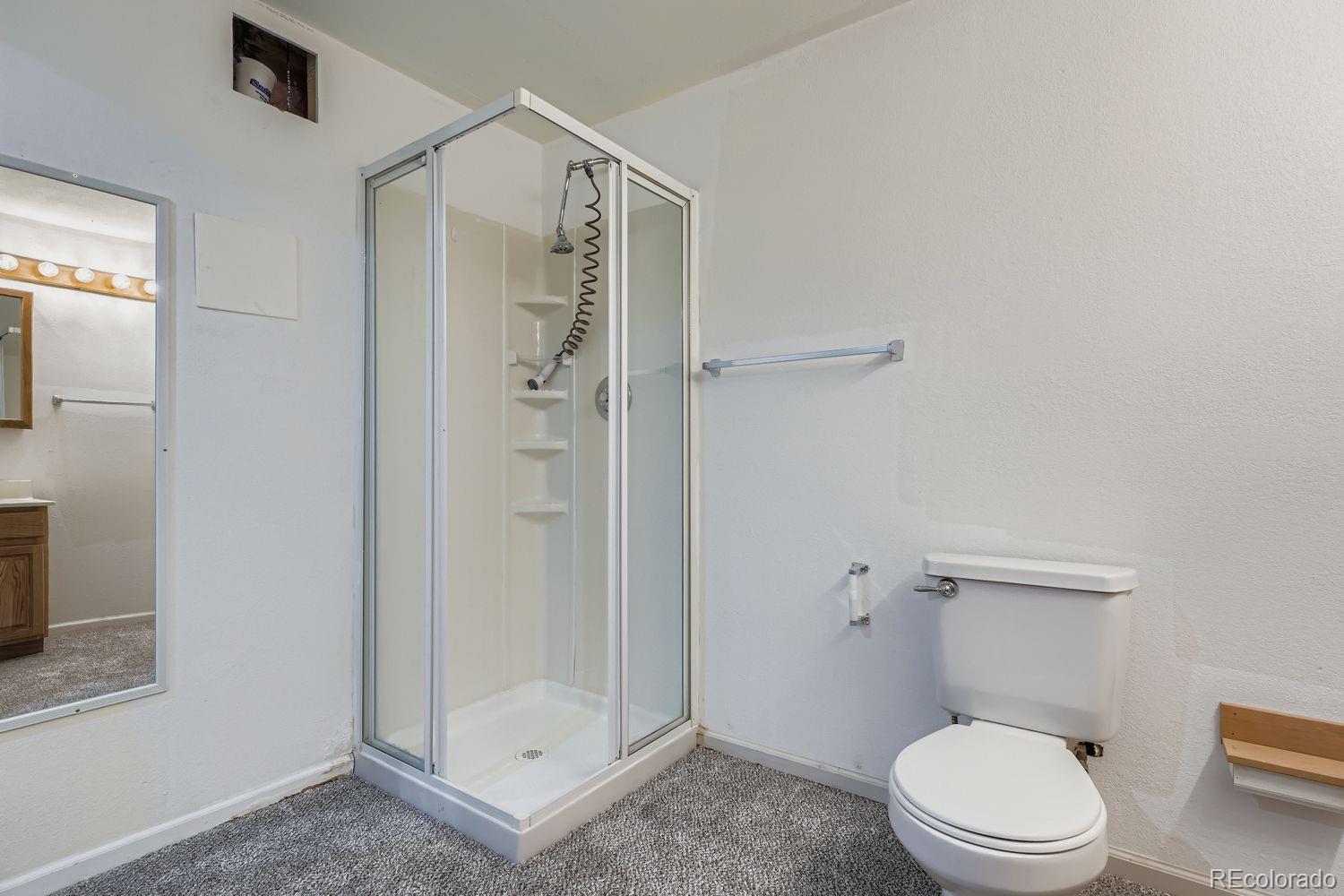 19827 East Prentice Avenue Centennial, CO 80015 - Photo 26 of 31 a white toilet sitting next to a bathroom sink