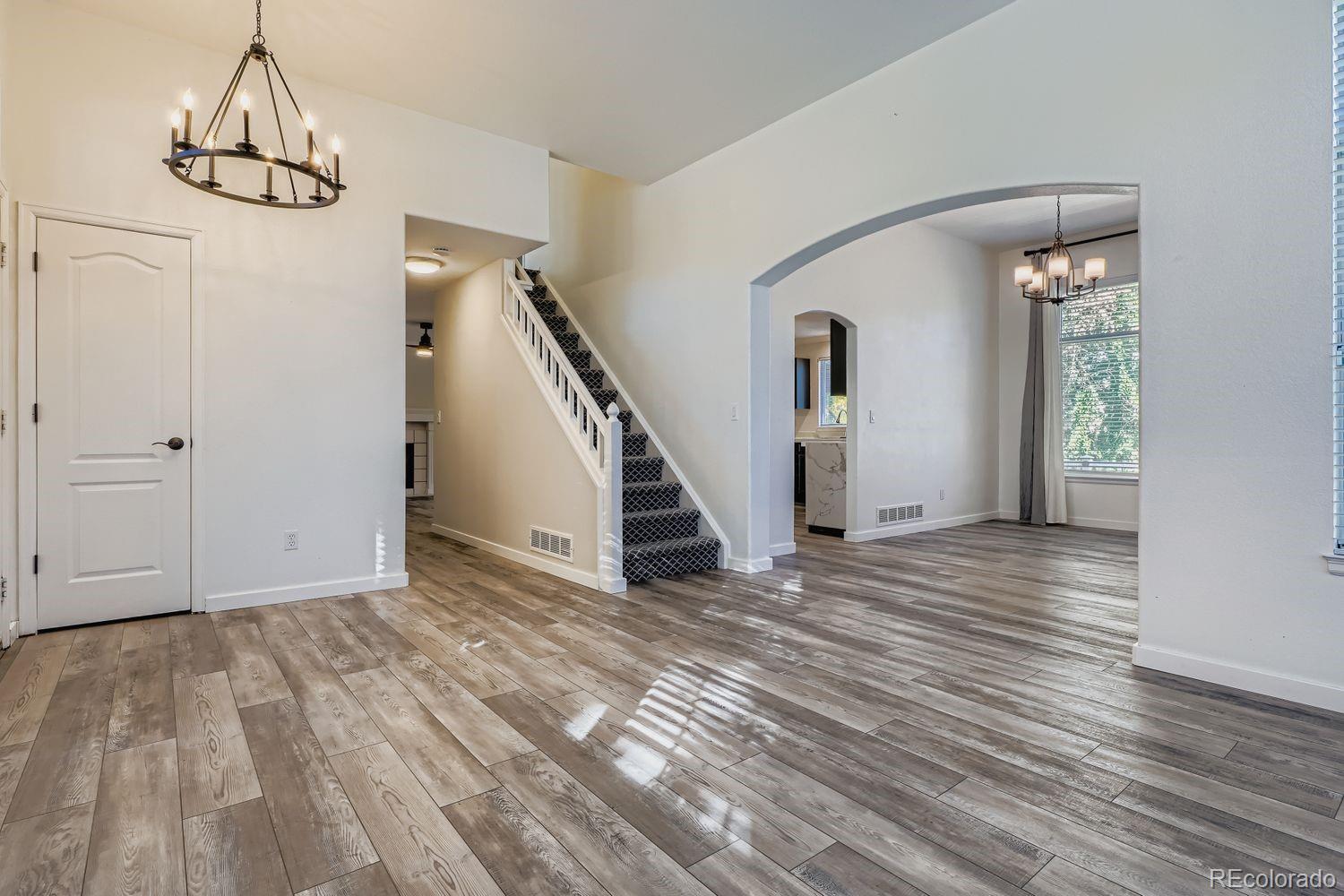 19827 East Prentice Avenue Centennial, CO 80015 - Photo 7 of 31 a view of empty room with wooden floor and window